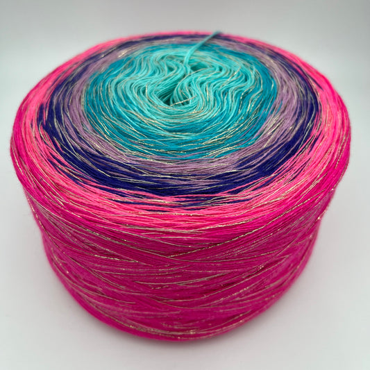 Farbverlauf Bobbel mit Glitzer Beilauffaden, von innen nach aussen in den Farben Türkis, Lila und Rottöne