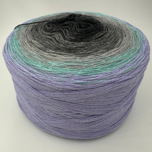 Farbverlauf Bobbel von innen nach aussen in heller werdenden Grautönen, Hellgrün und Lila