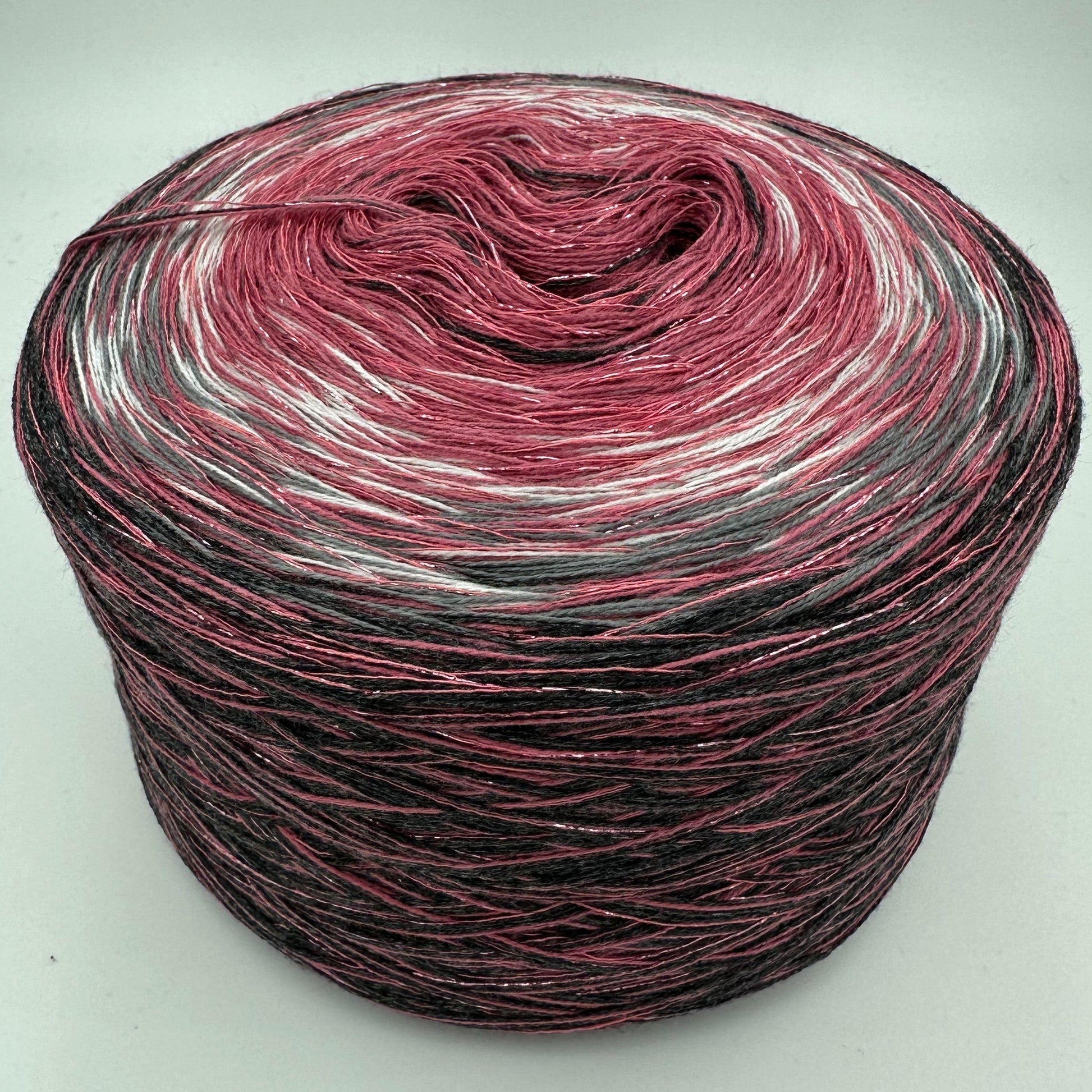 Farbverlauf Bobble von innen nach aussen Dunkelrose, Weis, Grau und Schwarz