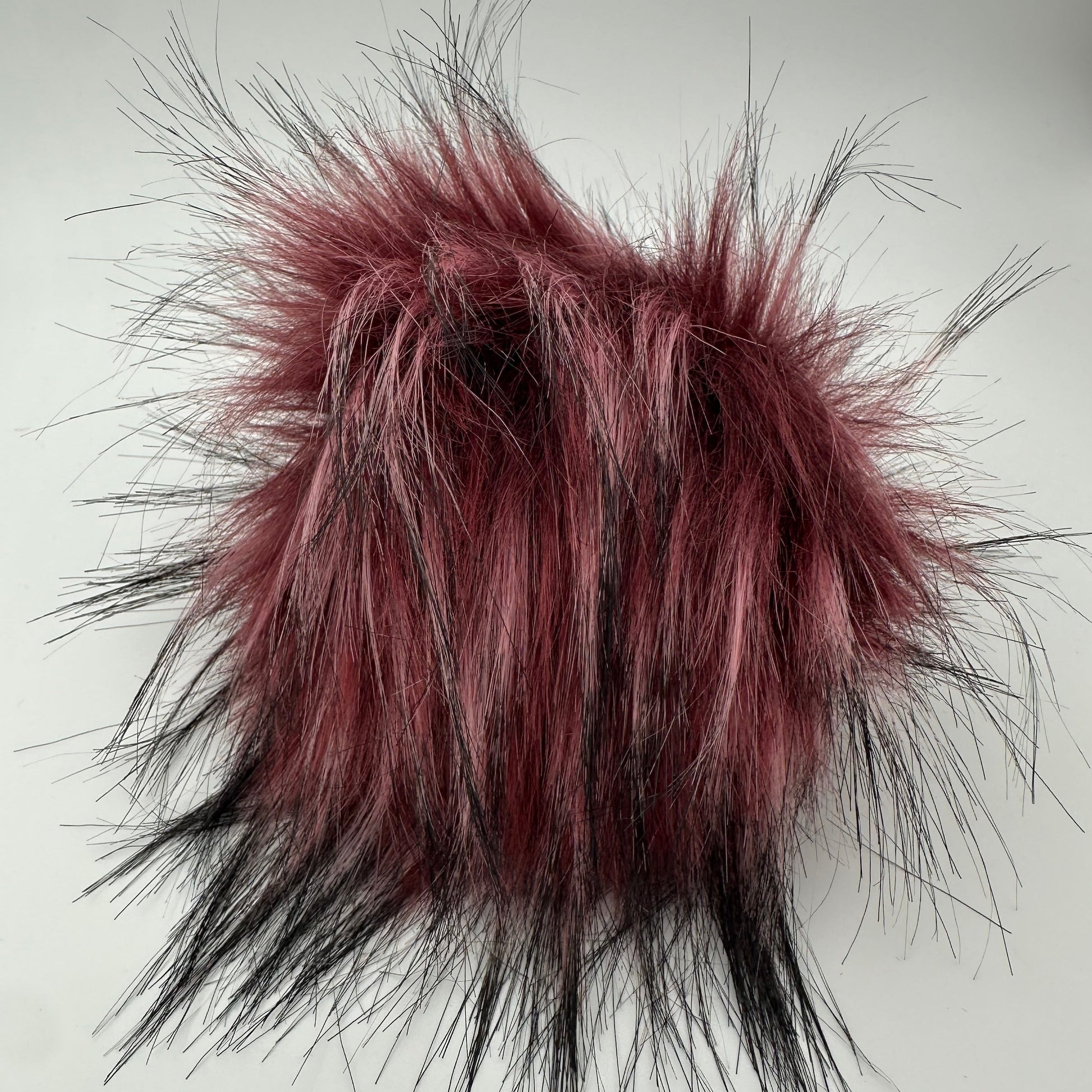 Bommel / Pompon in Beere